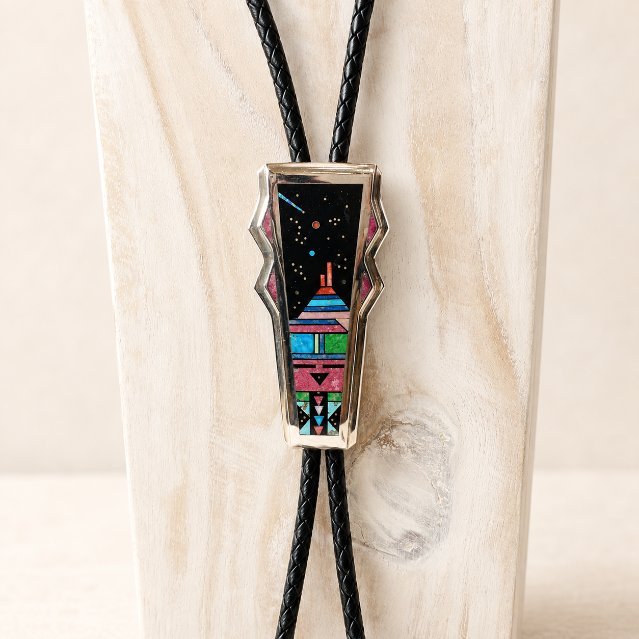 Jim Harrison, Navajo Silversmith Sterling Silver Inlaid Bola Tie with Coral, Opal, Turquise, Lapis, Gaspeite, Spiny Oyster Shell, Rhodochrosite and White Marble 
Night Sky Design with Yei Face  4" (tip to tip)