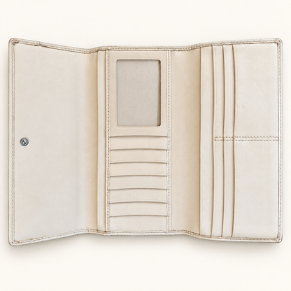 An open cream-colored leather wallet with multiple card slots, a central ID window, and a snap button closure, shown against a solid off-white background.