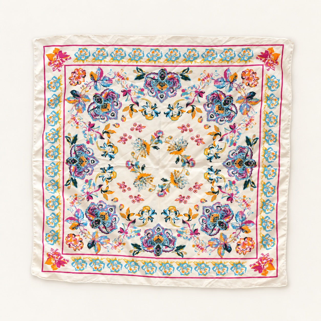 A square silk scarf with an intricate multicolor floral and botanical pattern, laid flat on a clean white background.