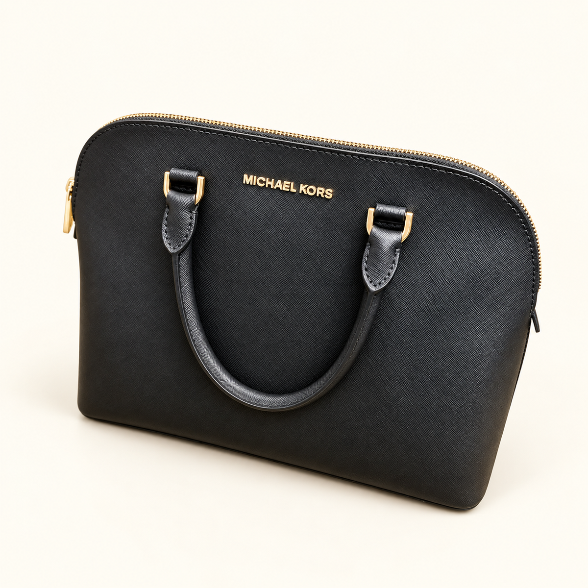 A black Michael Kors handbag with a curved top, double top handles, and gold-tone hardware, photographed on a clean off-white background.