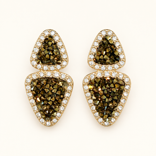 A pair of gold triangular stud earrings featuring textured brown and olive drusy crystal centers, surrounded by rows of small clear cubic zirconia stones, set against a plain off-white background.